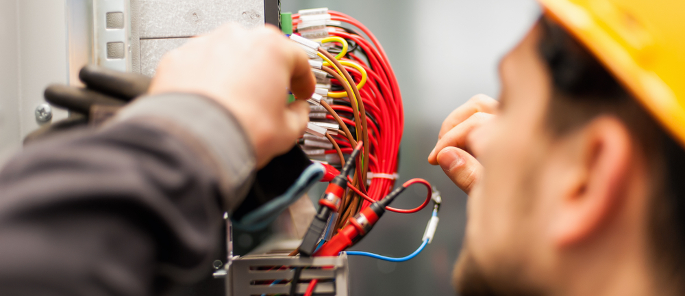 A man installing wires 