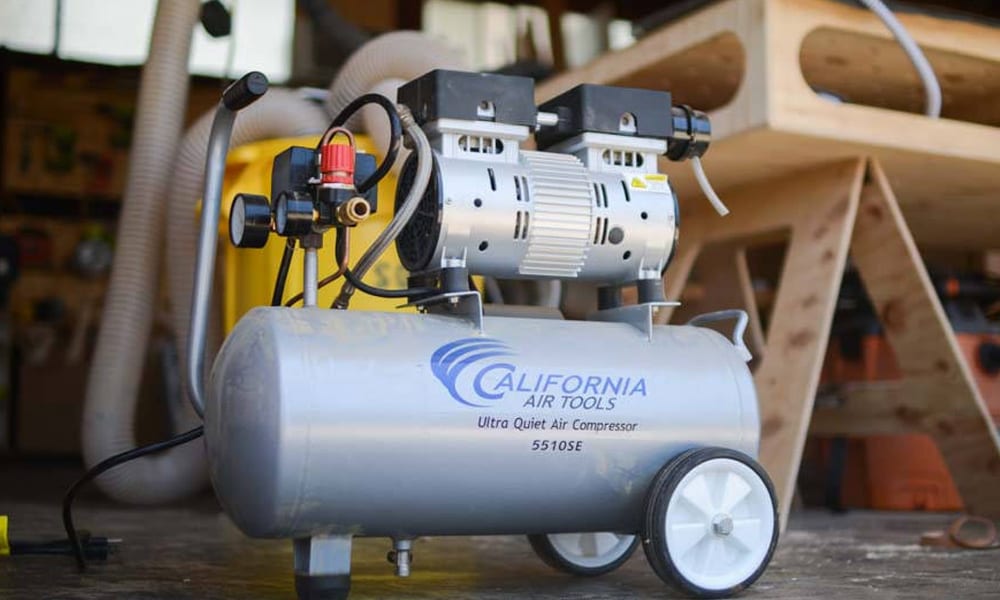 air compressor sitting in a workshop