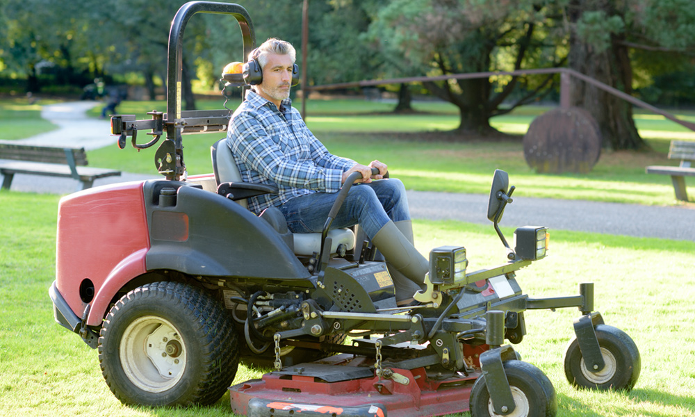 Man sitting on a zero turn mower