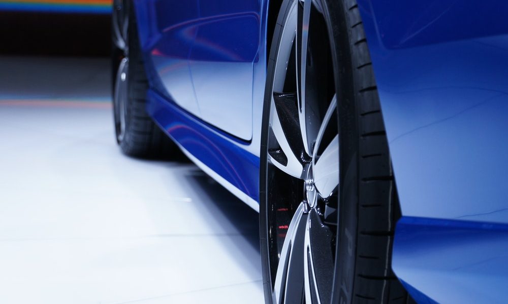 blue car with black and silver alloys