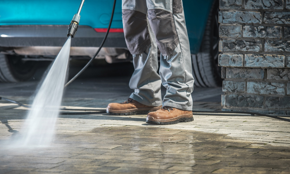  Gas Pressure Washer cleaning a driveway