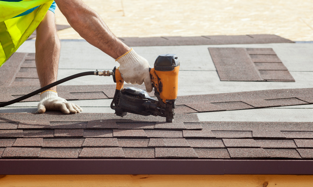 nail gun nailing roof tiles down