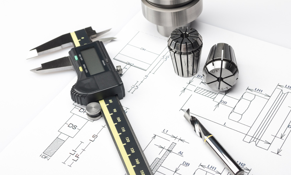 digital Caliper resting on diagrams