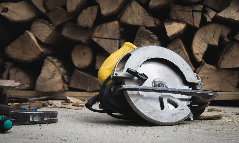 circular saw laying on the floor 