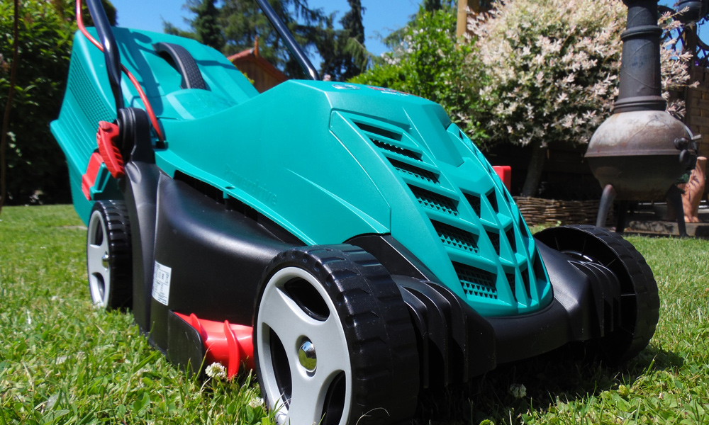 lawn mower sitting on a fresh cut lawn