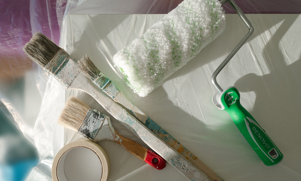 painting tools laid out on the floor