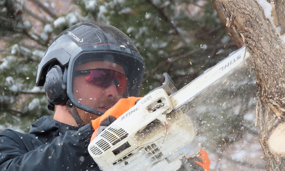 Man using a chainsaw 