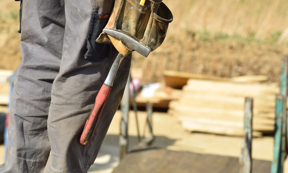 Close up of a hammer in a tool belt