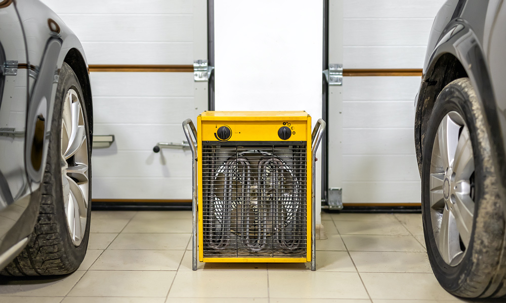 garage heater with two cars either side of it