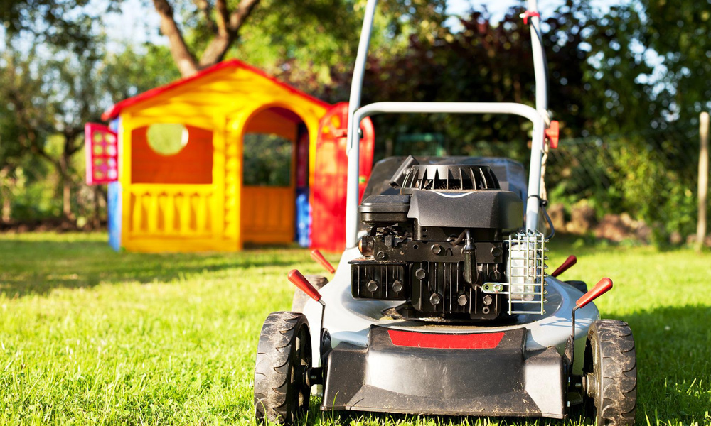 A gas lawn mower on a lawn