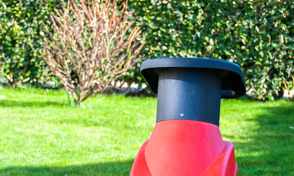 leaf mulcher sitting in a garden