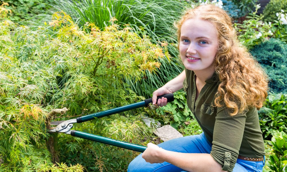 woman holding a pair of Loppers