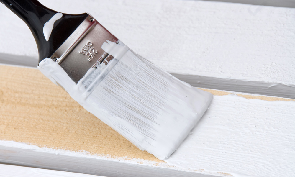 a paint brush covered in white paint