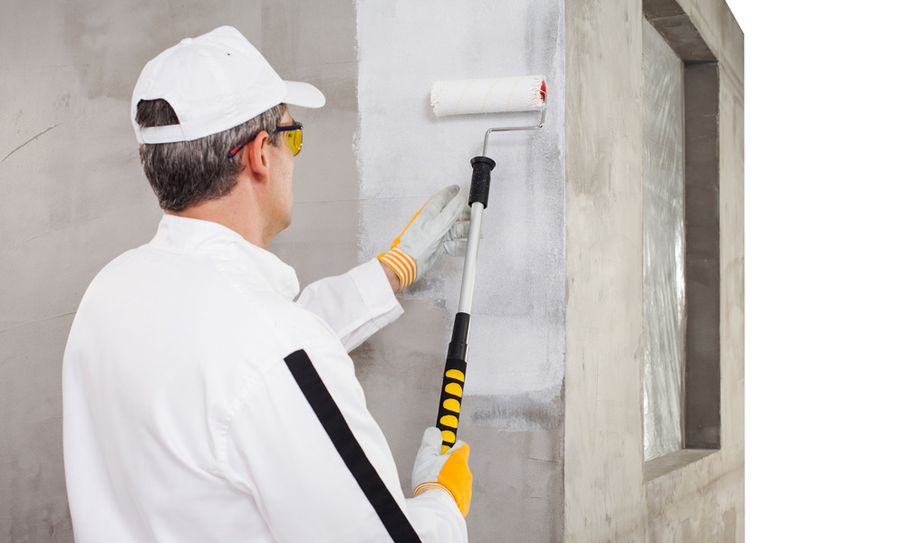 a man using a paint roller