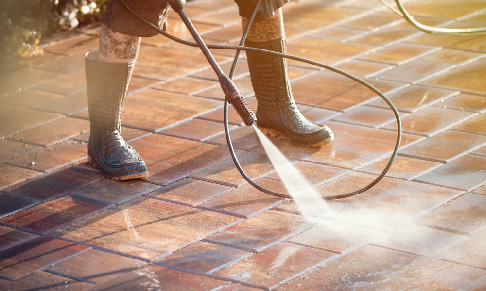 Cleaning a driveway with a pressure washer