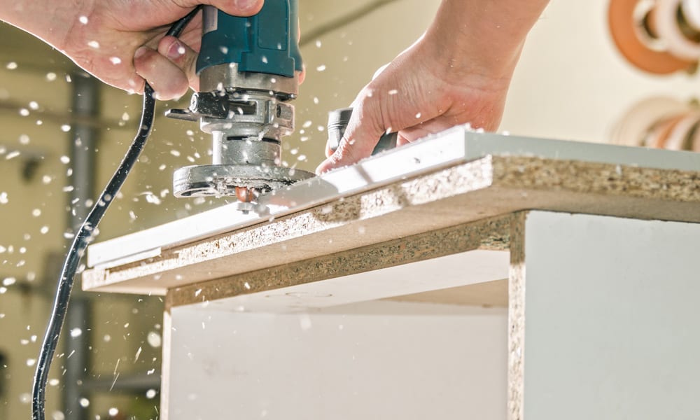 Router cutting through wood