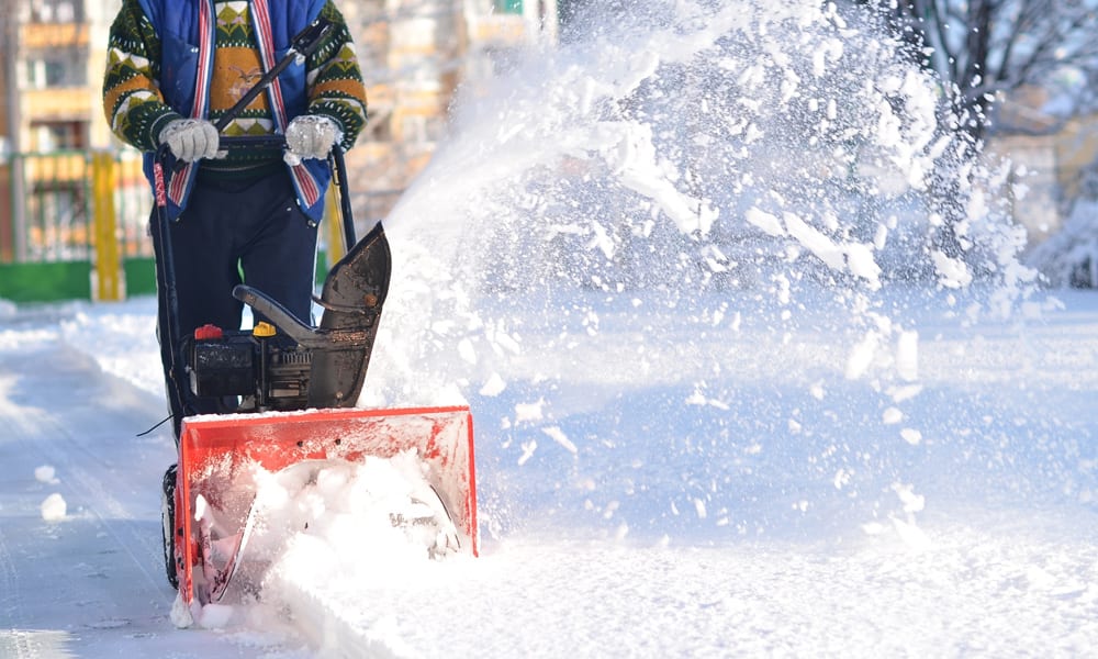 snow blower being used to clear snow 