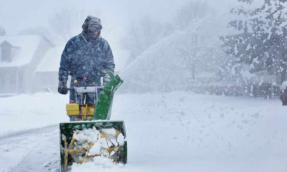 A snow blower clearing a pathway