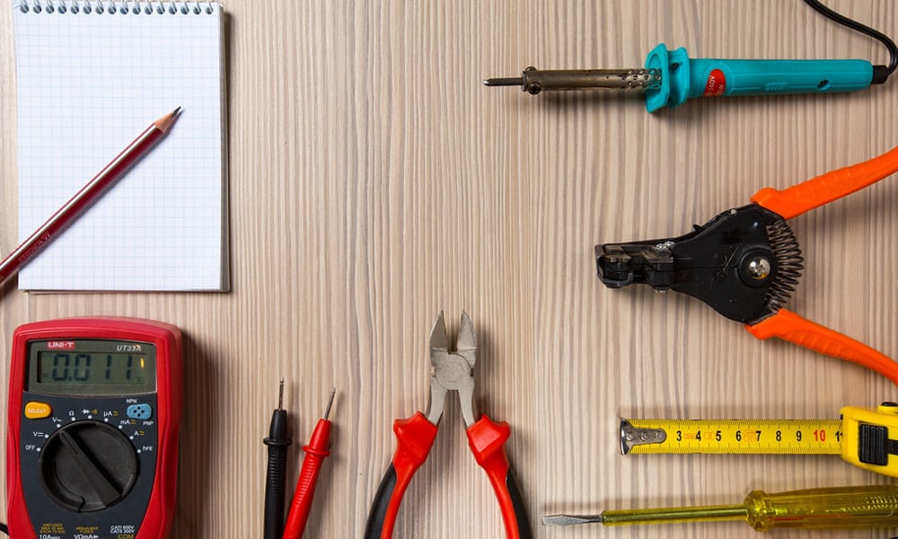 soldering Iron on a table with other tools