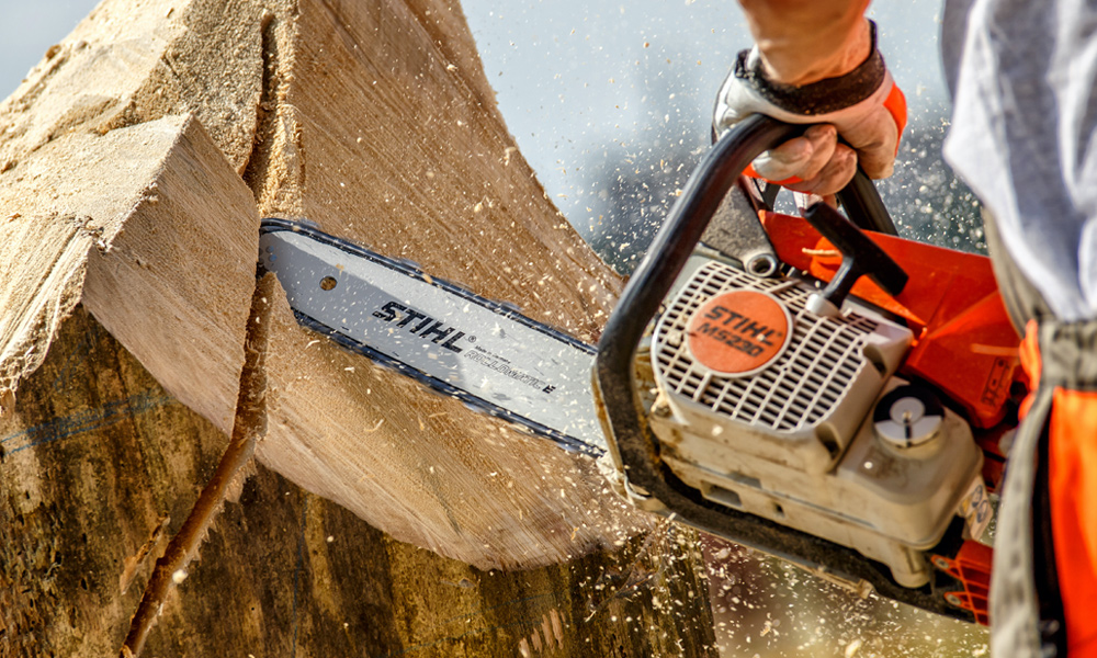 Stihl chainsaw cutting through wood