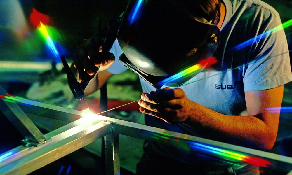 a man using a tig welder