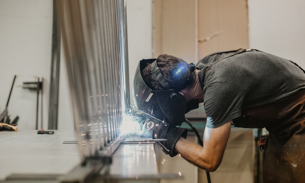 a workman wearing a welding helmet