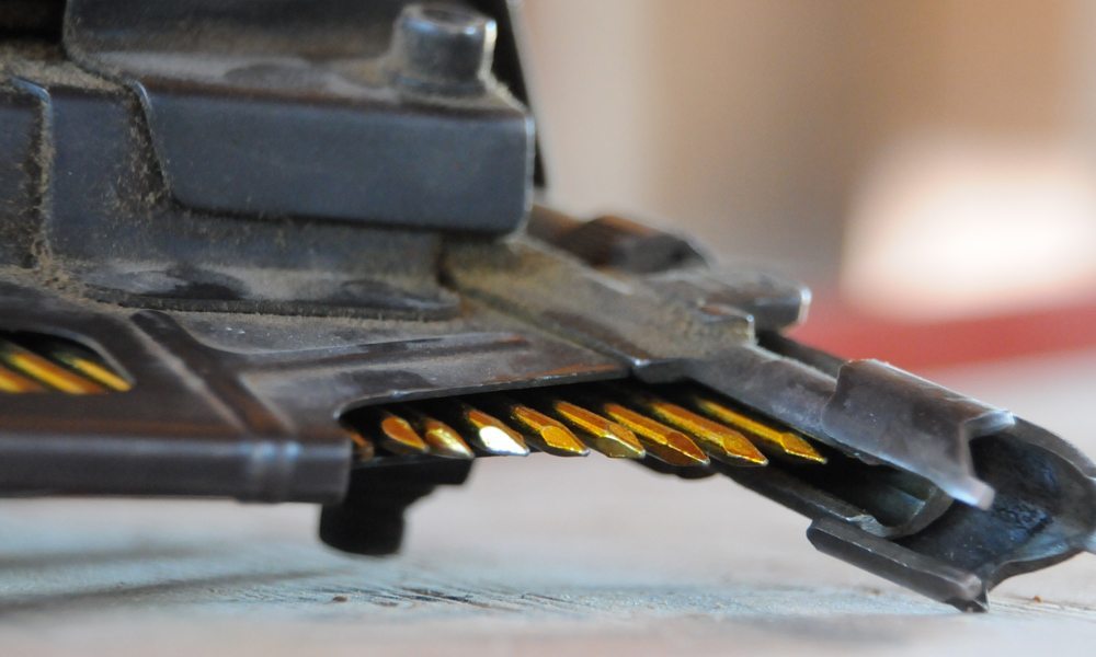 close up of a nail gun magazine clip