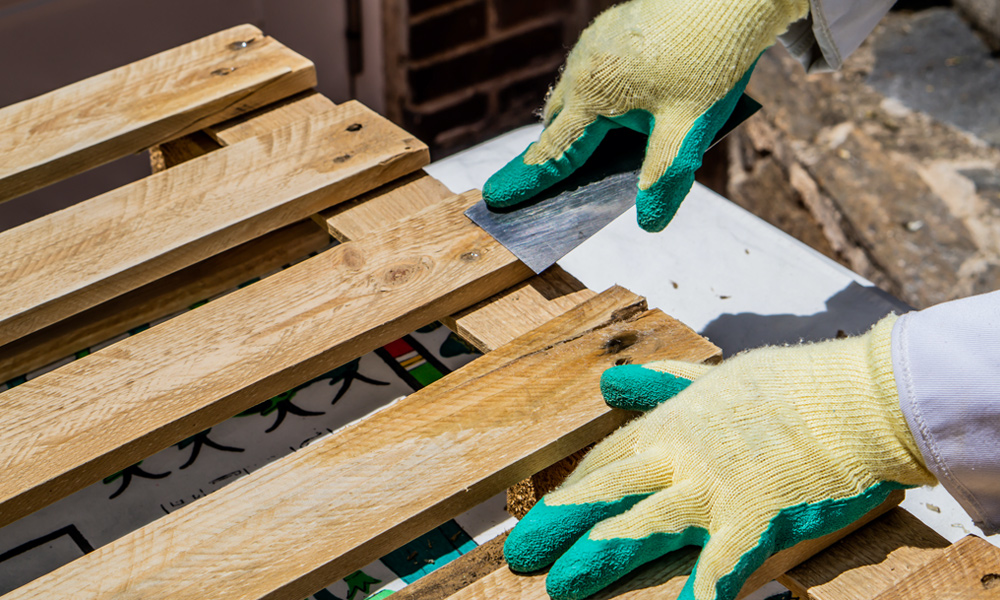 scraper filling pallet wood in